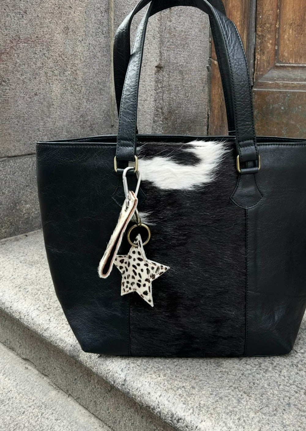 Noral star cowhide keyring – White/dark-brown/black