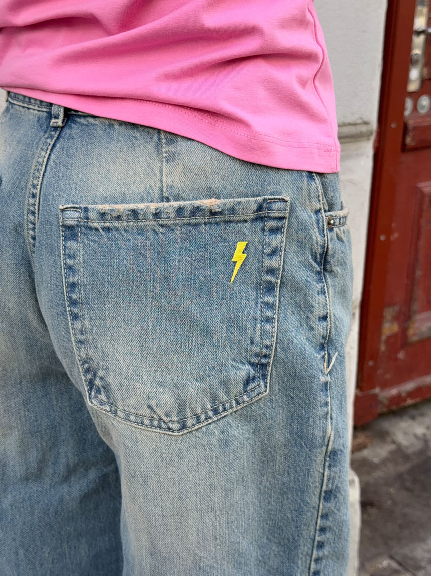 Alaia low-rise jeans with lightning detail - Light denim