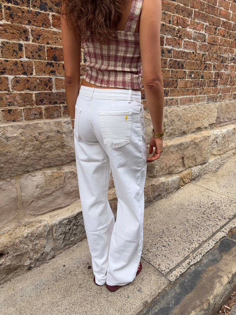 Alaia low-waisted jeans with lightning detail - White denim